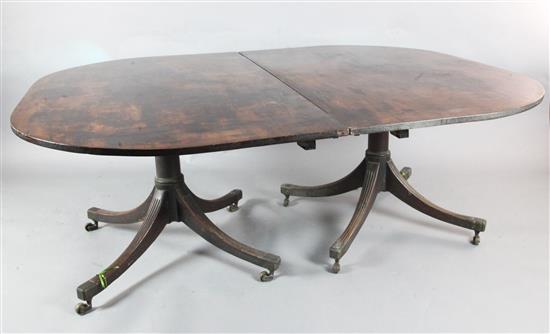 A George III mahogany twin pillar dining table, circa 1800, extends to 12ft 3in. x 5ft 2.5in.
